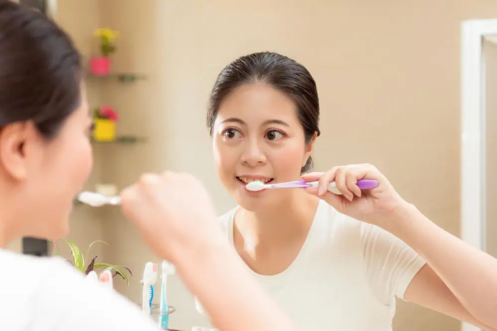 ผู้หญิงที่ได้รับการรักษารากฟันหน้า